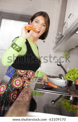 modern woman preparing some healthy food at her kitchen (selective focus with shallow DOF)