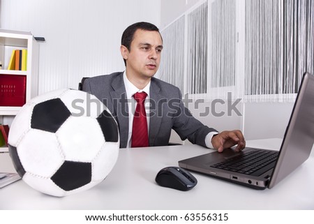 Mature football businessman manager working at the office