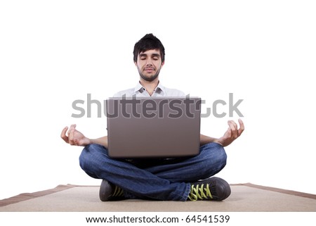 Young man in yoga lotus position with his laptop computer at home (white background)