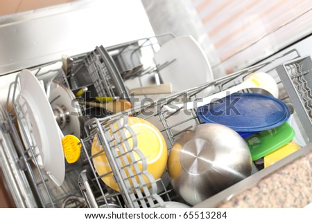 dishwasher with dirty dishes (selective focus with shallow DOF)