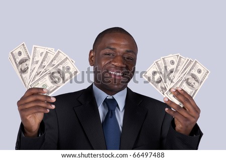 Successful and wealthy african businessman showing you money