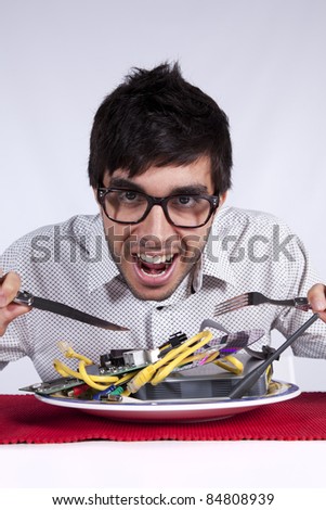 [Image: stock-photo-crazy-young-man-eating-techn...808939.jpg]