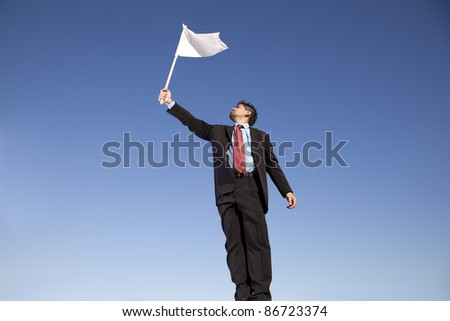 businessman asking for surrendering holding a white flag