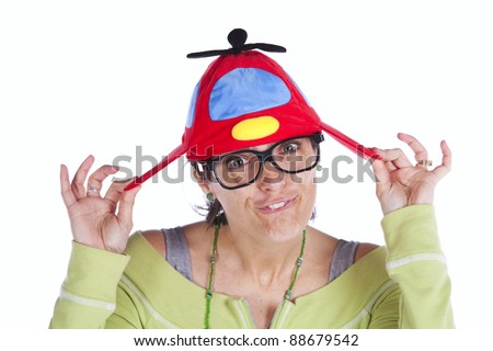 Woman making a funny face with a Propeller Beanie hat (isolated on white)