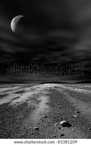 Night stony desert with moon and black sky.