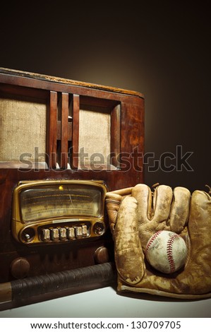 National Pastime/An antique radio with a bat, mitt, and baseball.