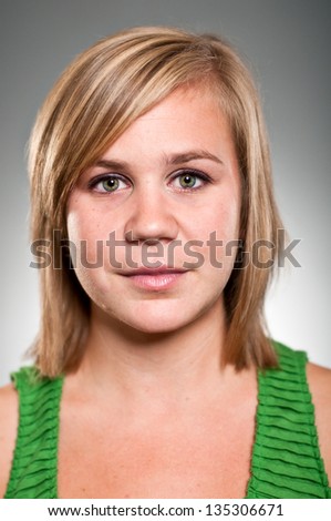 A Caucasian woman in her 20\'s with a blank expression.