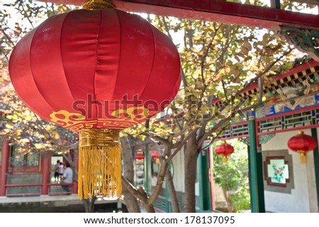 A red lantern hand on at a Chinese garden