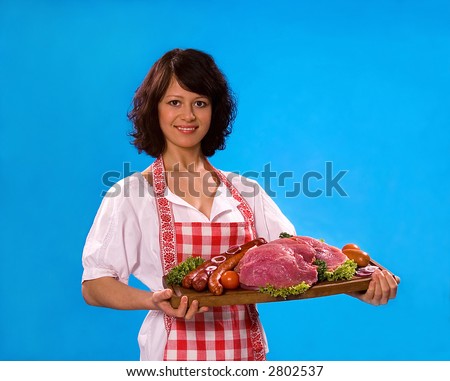 Young attractive housewife offers meat products, isolated on white background