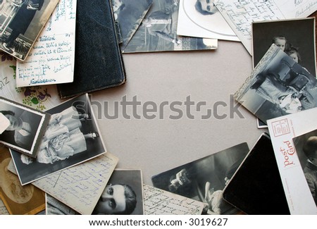 Vintage background with a frame of old postcards, old family photos and old notebooks