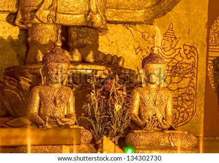 BAGAN, MYANMAR - FEB 22: Small Buddha statues covered with gold flakes in Ananda Temple (Indian Style Structure) on Feb 22, 2012 in old Bagan, Myanmar. Built around 1105 by King Kyanzittha.
