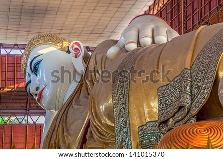 YANGON, MYANMAR - MAR 1: The giant reclining Buddha at Chaukhtatgyi temple on Mar 1, 2012 in Yangon, Myanmar. One of the biggest and most graceful Reclining Buddha statues in South East Asia.