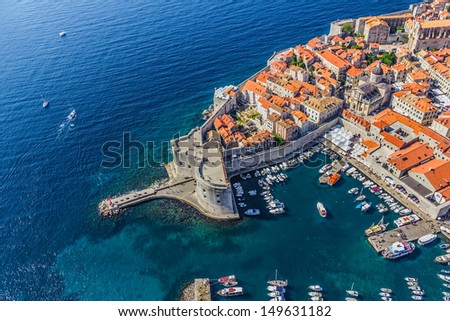 Aerial helicopter shoot of Dubrovnik old town harbor and st. John fortress.