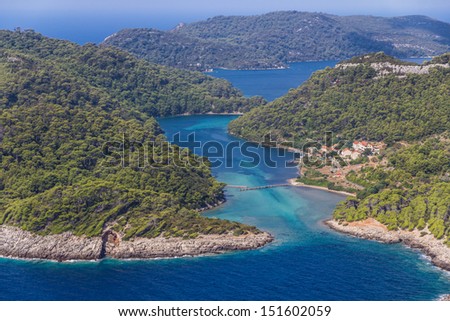 Aerial helicopter shoot of sea entrance of the National park on island Mljet, Dubrovnik archipelago, Croatia. The oldest pine forest in Europe preserved.