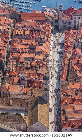 Aerial helicopter shoot of Dubrovnik old town. Main street Stradun (Placa) full visible.