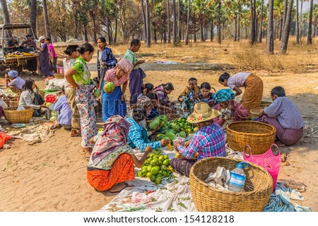 BAGAN, MYANMAR - FEBRUARY 24: Women are selling vegetables at the local market on February 24, 2013 in Bagan, Myanmar. All the food is organically grown.