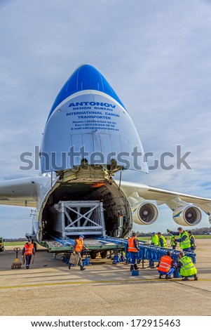ZAGREB, CROATIA - NOVEMBER 10: Loading heavy weight cargo to the Antonov 225 Mriya airplane on November 10, 2013 Zagreb, Croatia. It is the biggest airplane in the world.