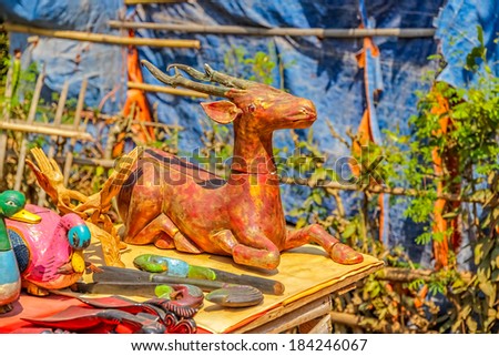 INDEIN, MYANMAR - FEBRUARY 28 2013: Street market booth with lot of wooden souvenirs on traditional market which is held every fifth day.