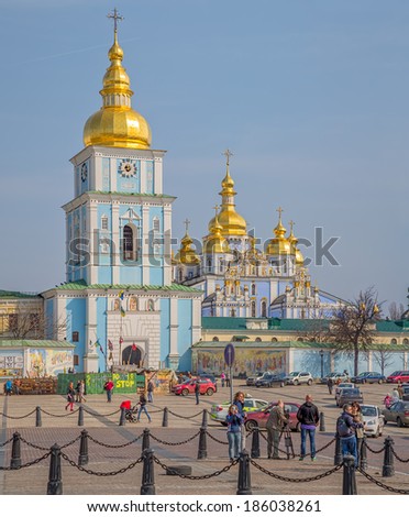 KIEV, UKRAINE - MARCH 23, 2014: St. Michael\'s Golden-Domed Monastery with barricades still stands in front of it, with TV crew filming it..