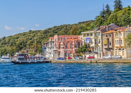 ISTANBUL, TURKEY - SEPTEMBER 29, 2013: View of the old waterfront houses in Yenikoy, sailing Bosporus..