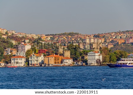 ISTANBUL, TURKEY - SEPTEMBER 29, 2013: View of the first raw of the waterfront houses in Kanlica sailing Bosphorus. Anadoluhisari, Erdal Inonu Yalisi