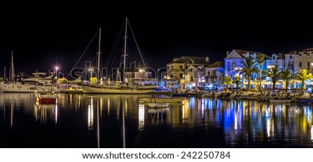 SUPETAR, CROATIA - July 23, 2014: Boats and yachts moored in the port on a beautiful summer night on island Brac.