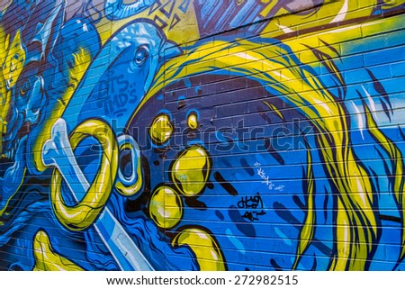 MELBOURNE, AUSTRALIA - MARCH 21, 2015: Colorful graffiti detail in back alley of downtown.