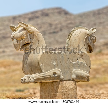 Sculpture of a Homa Bird in Persepolis, Iran. Two eagle-griffin capital has given the inspiration for the logo of Iran\'s National Airline Homa.