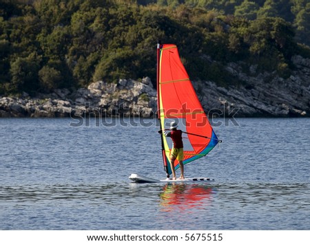 Learning to sail on a sailboard. Shot in Croatia, Adriatic sea.