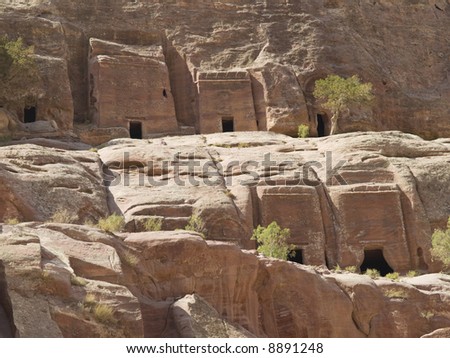 Small tombs in Petra (Street of Facades part) - Nabataeans capital city (Al Khazneh) , Jordan. Made by digging a holes in the rocks. Roman Empire period.