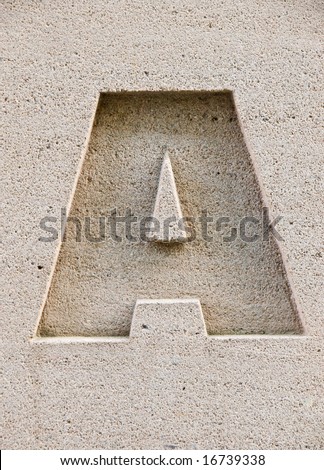 Letter A carved in a stone block.