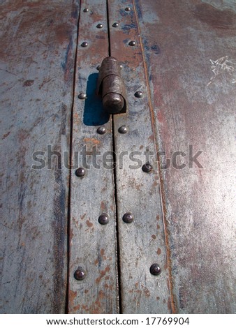 Small metal well detail shot in Venice, Italy. Metal door