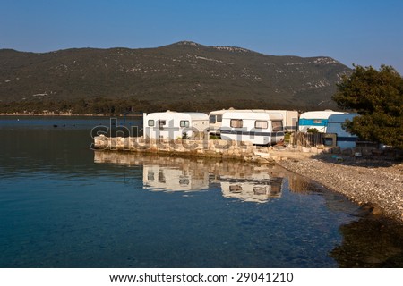 Tourist camp area for caravans near sea in small village Hodilje near Ston on Peljesac peninsula, Croatia, Europe.