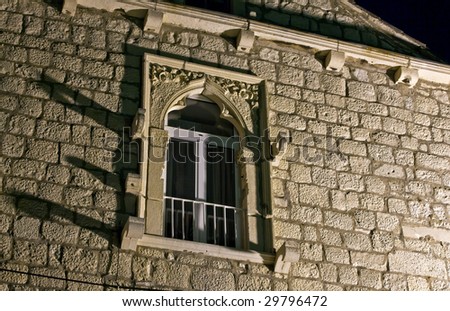 Old stone window in old medieval town Korcula  by night. Croatia, Europe.
