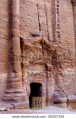 Tombs in Petra (Street of facades) - Nabataeans capital city (Al Khazneh) , Jordan. Made by digging a holes in the rocks. Roman Empire period.