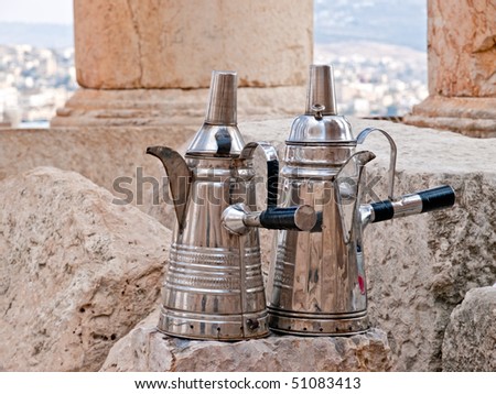 Making coffee and tea in Ajlun, Jordan. Typical arab pots.