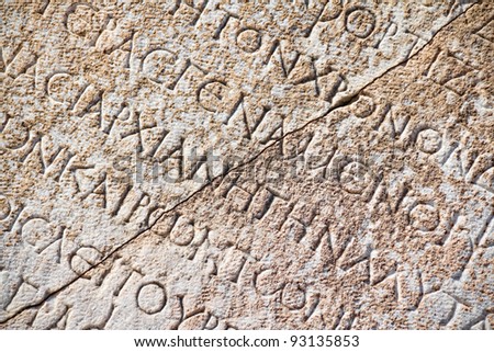 Detail with Roman inscription on latin language in Ephesus (Efes), Turkey.