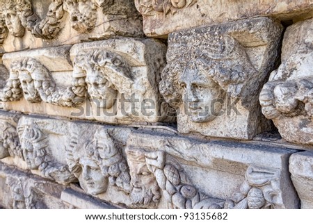 Building relief detail of architectural frieze with human head in Aphrodisias (Turkey) build during Roman period.
