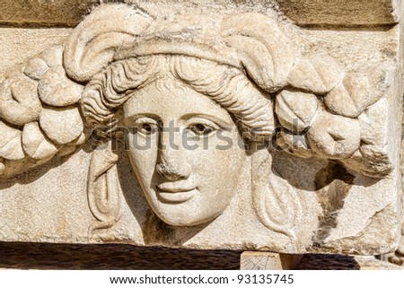 Building relief detail of architectural frieze with human head in Aphrodisias (Turkey) build during Roman period.