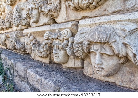 Building relief detail with human head of architectural frieze in Aphrodisias (Turkey) build during Roman period.