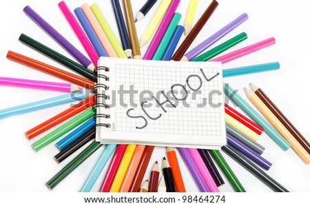 Close up of color pencils with different color over white background. School.