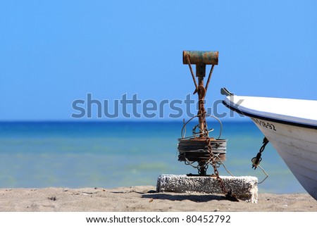beach with blue water and boat tie line