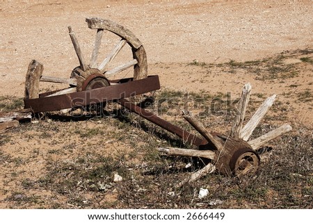 old broken cart wheels and axle