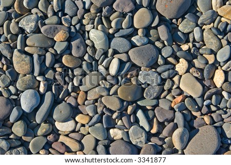 a pile of rocks or pebbles on the beach