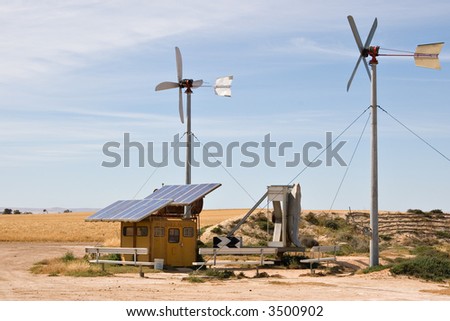 homemade wind and solar energy sources at an alternative energy farm using recycled materials