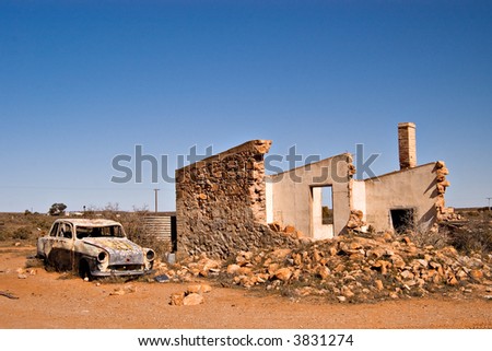 an old car and ruins in the australian outback