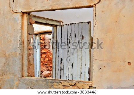 look through the window and the door in the ruins