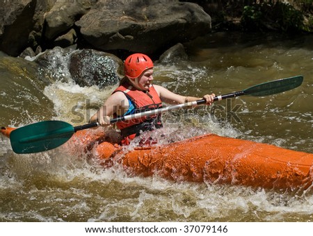 great image of a teenager girl white water kayaking