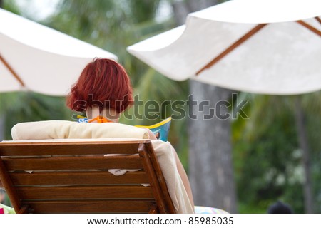 woman resting on beach chair