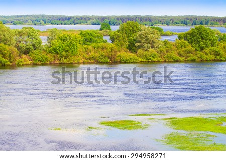 horizontal landscape: the river flooded the valley